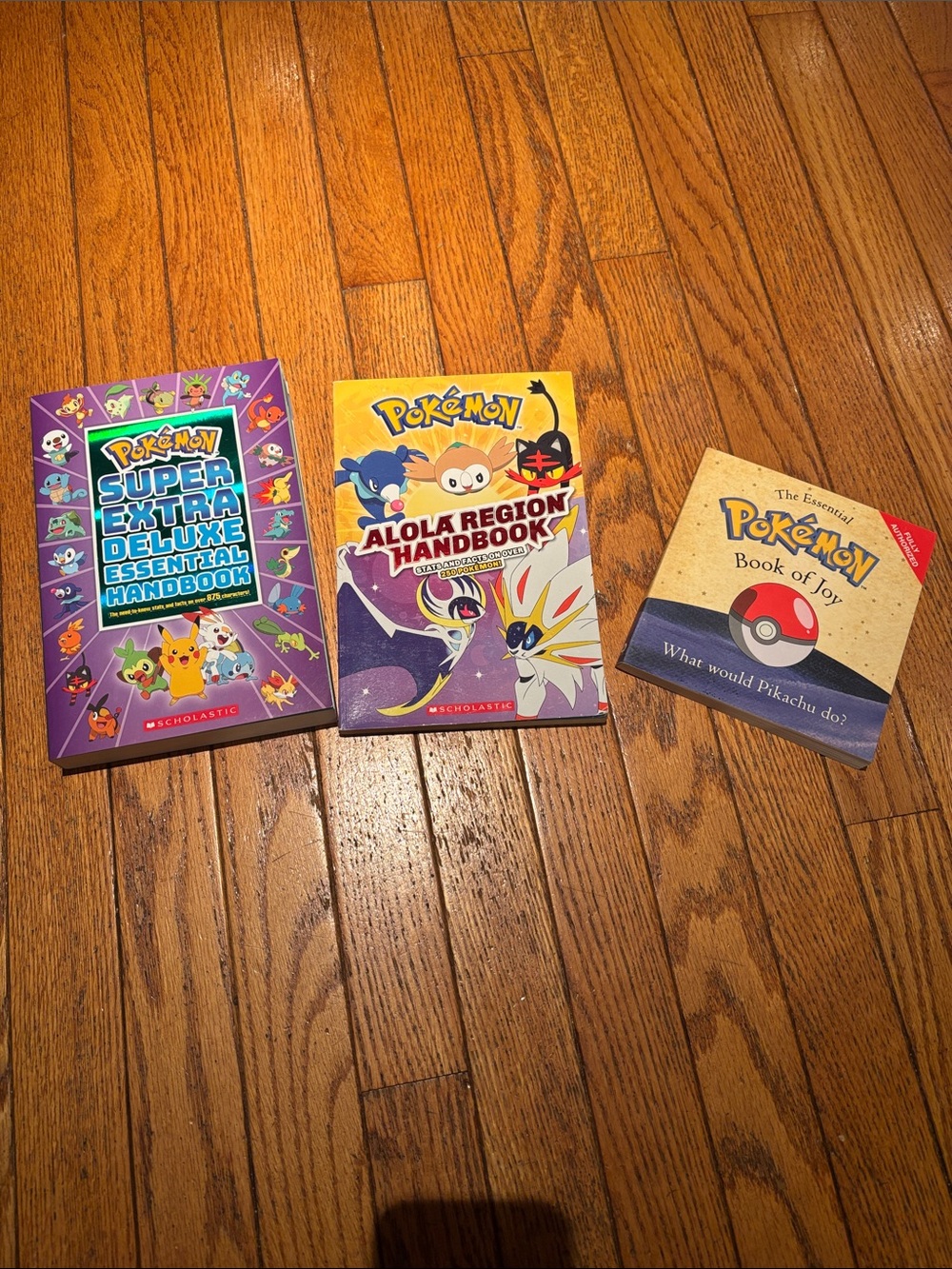 Pokémon Lot of 3 Books: Alola Region Handbook, Super Extra Deluxe & Book of Joy